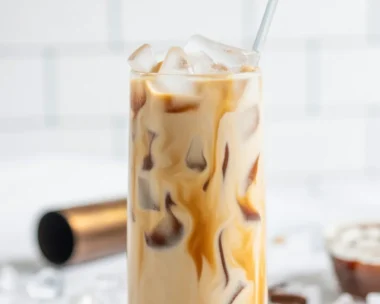 Salted Caramel White Russian cocktail garnished with caramel sauce and salt.