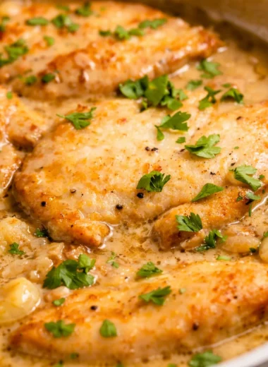 Creamy garlic butter chicken in a rich, savory sauce served on a plate