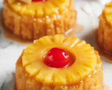 Delicious Pineapple Upside Down Sugar Cookies topped with pineapple and cherries.