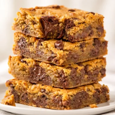 Delicious Peanut Butter Chocolate Chip Bars stacked on a plate