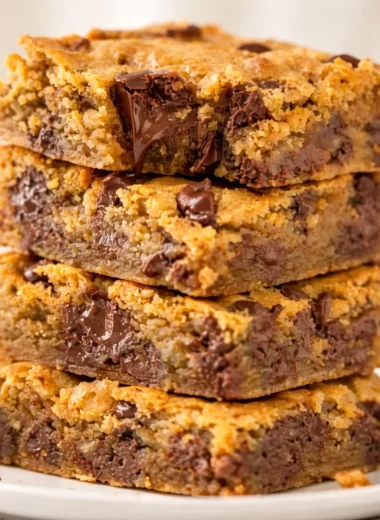 Delicious Peanut Butter Chocolate Chip Bars stacked on a plate
