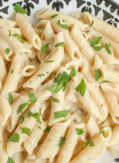 One-Pot Creamy Garlic Parmesan Pasta in a skillet, garnished with parsley.