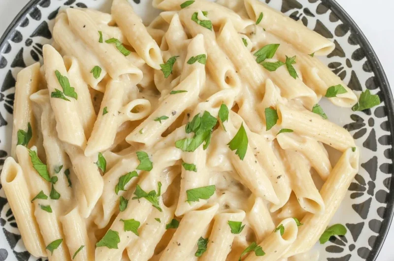 One-Pot Creamy Garlic Parmesan Pasta in a skillet, garnished with parsley.