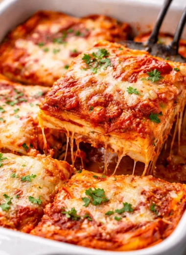 Delicious homemade lasagna layered with pasta, marinara sauce, ricotta, and mozzarella.