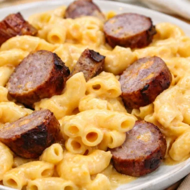 Creamy Cheesy Bratwurst Mac & Cheese with melted cheddar and savory bratwurst slices.