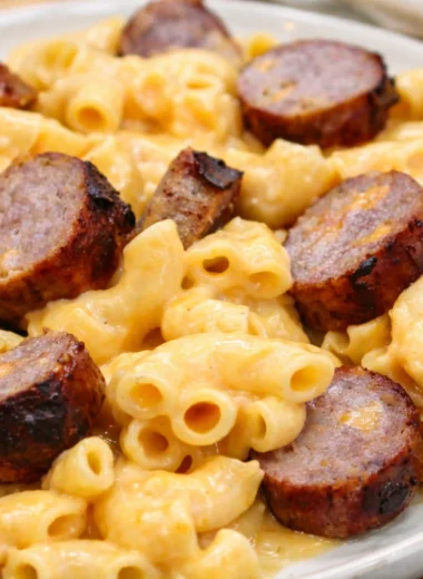 Creamy Cheesy Bratwurst Mac & Cheese with melted cheddar and savory bratwurst slices.