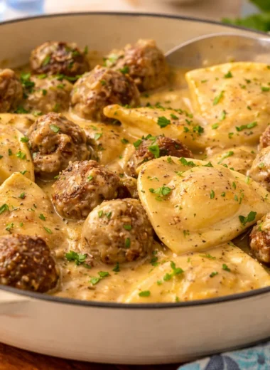 One Skillet Pierogi & Meatball Skillet served in a pan with toppings