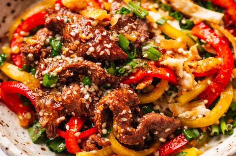Delicious Korean BBQ Steak Bowls with marinated beef and spicy sesame dressing.