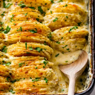 Delicious cheesy scalloped potatoes baked in creamy cheese sauce.
