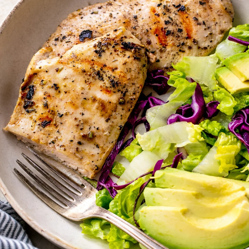 Quick and Easy Tips for Perfectly Grilling Thin Chicken Breast 33 Grilled thin chicken breast cutlets cooked to perfection on a BBQ grill.