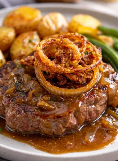 Traditional Zwiebelrostbraten - German Onion Beef Roast with crispy fried onions.