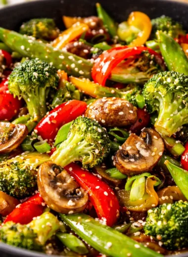A colorful vegetable stir fry in a skillet, showcasing fresh ingredients and vibrant colors.