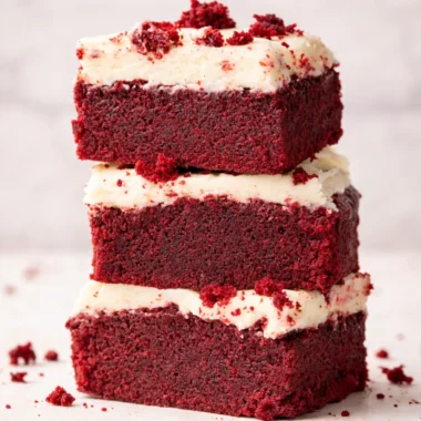 Delicious Red Velvet Brownie Bites topped with cream cheese frosting.