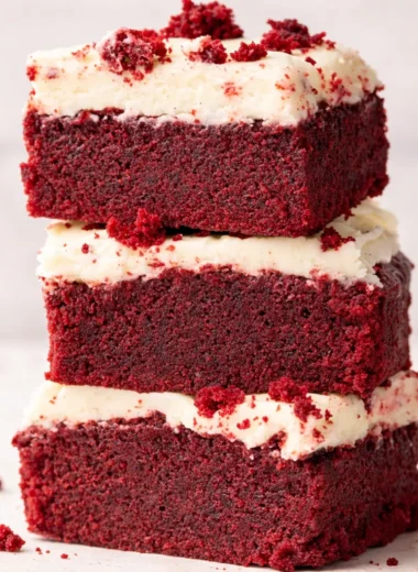 Delicious Red Velvet Brownie Bites topped with cream cheese frosting.