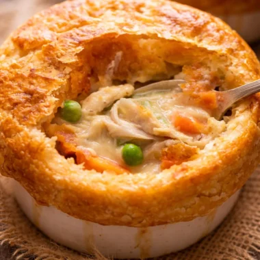 Delicious Australian chicken pie with creamy filling and flaky pastry crust.