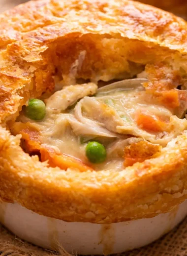 Delicious Australian chicken pie with creamy filling and flaky pastry crust.