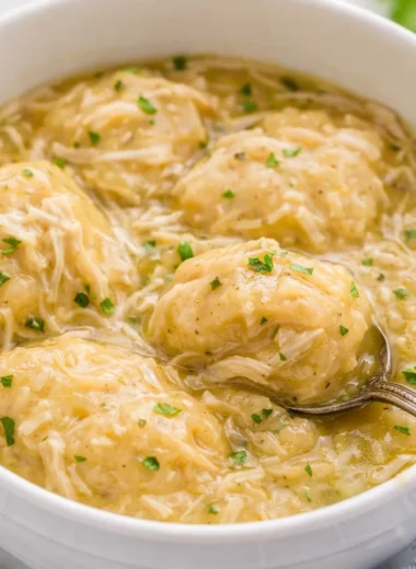 Bowl of creamy Crockpot Chicken and Dumplings with tender chicken and fluffy dumplings.