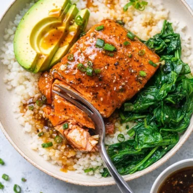 Delicious Teriyaki Salmon Rice Bowls served with vegetables and rice.