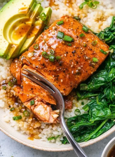 Delicious Teriyaki Salmon Rice Bowls served with vegetables and rice.