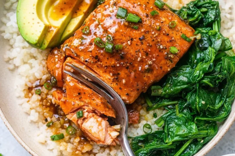 Delicious Teriyaki Salmon Rice Bowls served with vegetables and rice.