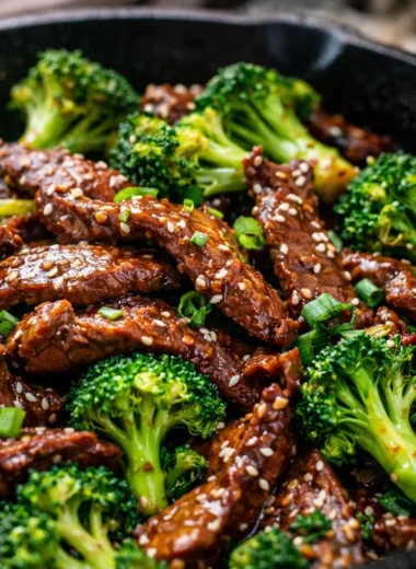 Delicious Beef and Broccoli Stir Fry Better Than Takeout in a bowl with chopsticks.