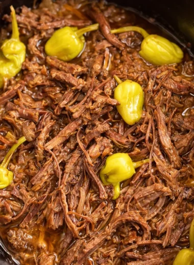 Delicious and tender Slow Cooker Mississippi Pot Roast with ranch dressing and pepperoncini.