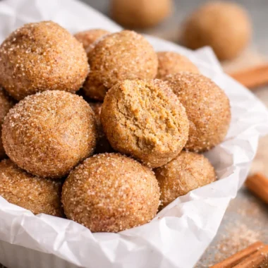No-bake Snickerdoodle Protein Balls with cinnamon and nut butter, perfect for a healthy snack.