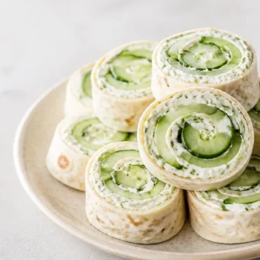 Crispy cucumber dill pinwheels served on a platter as a delicious appetizer