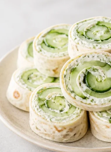 Crispy cucumber dill pinwheels served on a platter as a delicious appetizer
