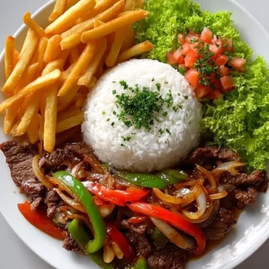 Crispy beef stir-fry with rice, fries, and colorful salad on a plate.