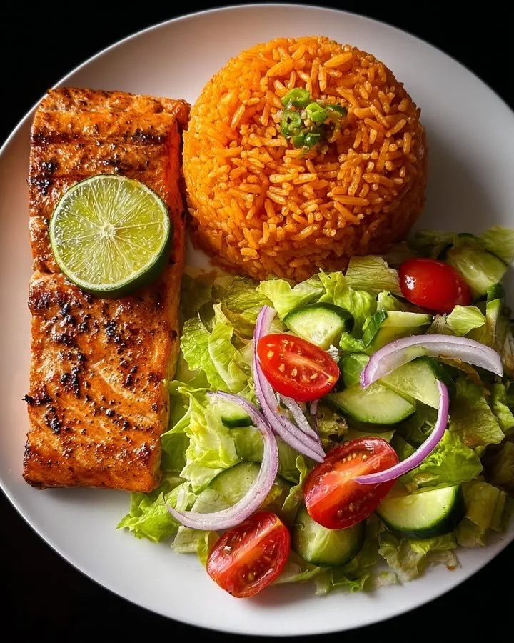Lime-glazed salmon served with Spanish rice and a fresh garden salad.