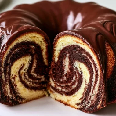 Authentic German Marble Cake Recipe with Chocolate Glaze 36 Slice of authentic German Marble Cake topped with chocolate glaze