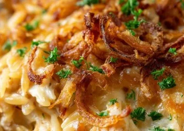 Creamy French Onion Chicken Orzo Casserole 25 Creamy French onion chicken orzo casserole garnished with herbs and cheese