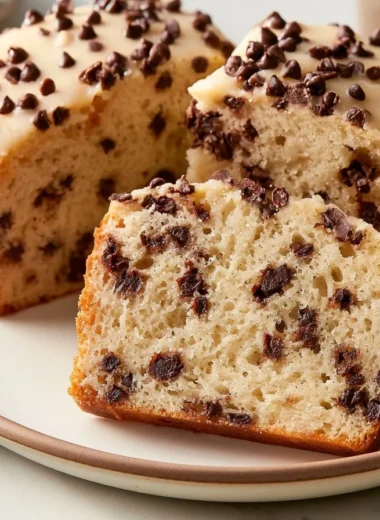 Creamy German Chocolate Crumble Cake topped with rich chocolate and coconut frosting