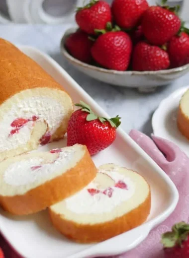 Creamy strawberry Japanese cake roll with fresh strawberries and whipped cream filling