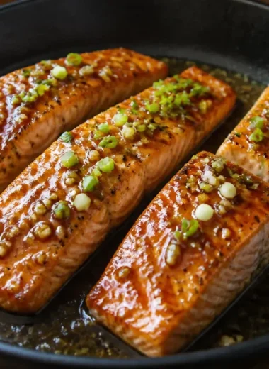 Delicious Honey Garlic Salmon served with vegetables and garnish