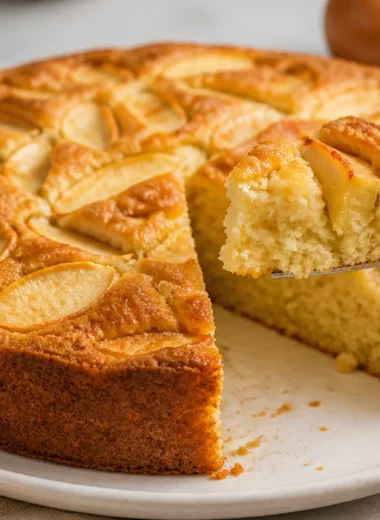 A slice of Torta di Mele della Nonna, a traditional Italian apple cake.